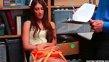 Student Davina Davis gets a few sticks from the head of security for theft in the store