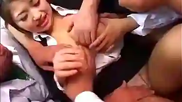 Sweet looking Japanese teacher gets sucks many cocks in this group sex session